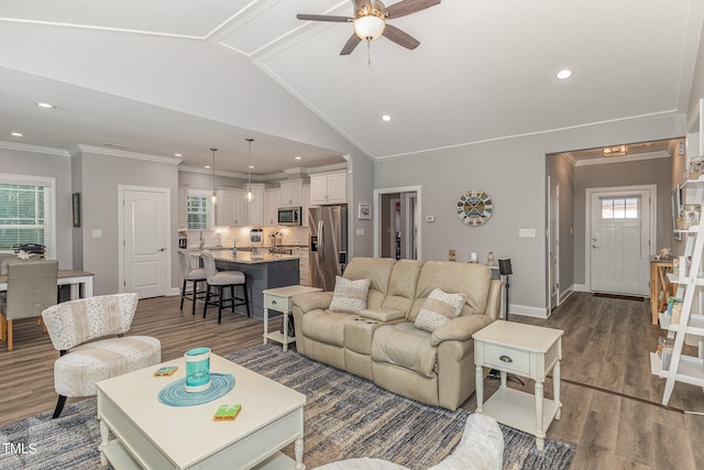 living room with dark hardwood / wood-style floors, crown molding, vaulted ceiling, and ceiling fan