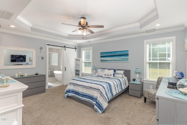 carpeted bedroom featuring crown molding, ceiling fan, a barn door, and a raised ceiling