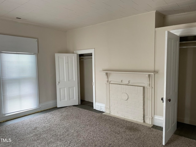 unfurnished bedroom featuring dark carpet