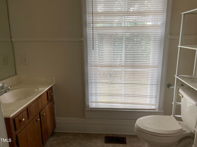 bathroom with vanity and toilet