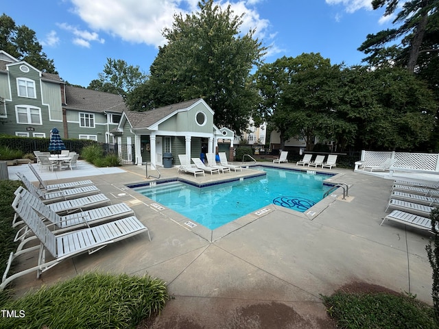 view of swimming pool featuring a patio