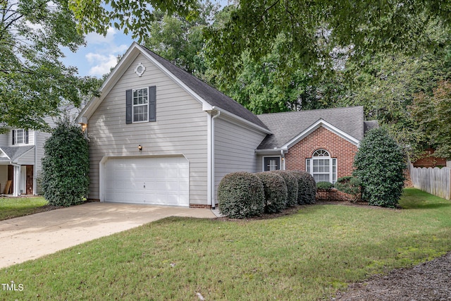 view of front property featuring a front yard and a garage