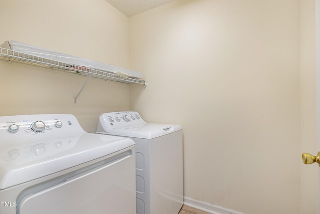 laundry room with separate washer and dryer