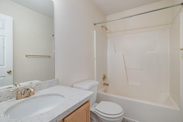 full bathroom with vanity, shower / bathing tub combination, a textured ceiling, and toilet