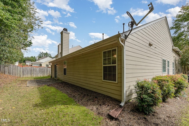 view of property exterior featuring a yard