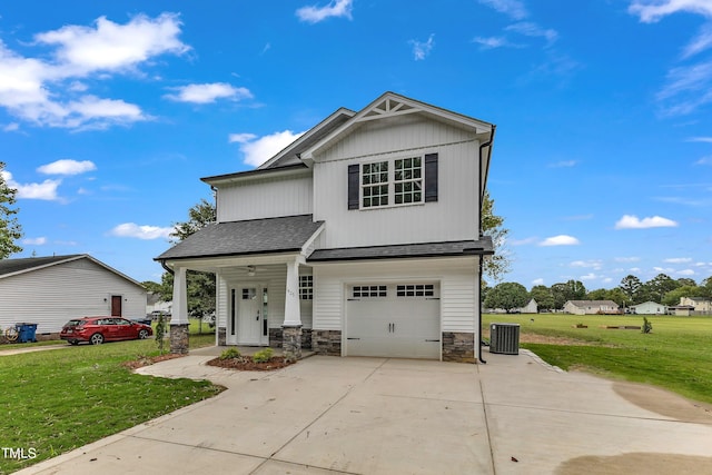 view of front facade with a garage, a porch, and a front lawn