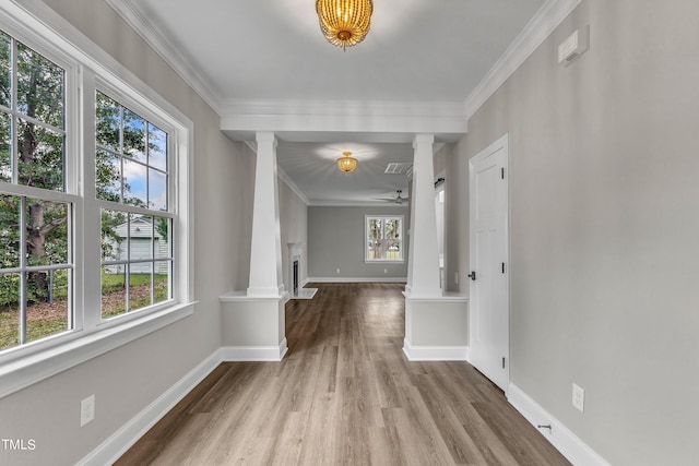 hall with a wealth of natural light and decorative columns