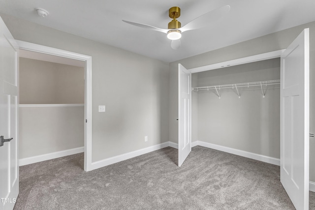 unfurnished bedroom featuring a closet, carpet, and ceiling fan