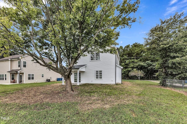 back of house with a yard