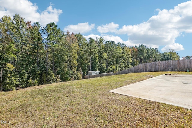 view of yard featuring a patio area and fence