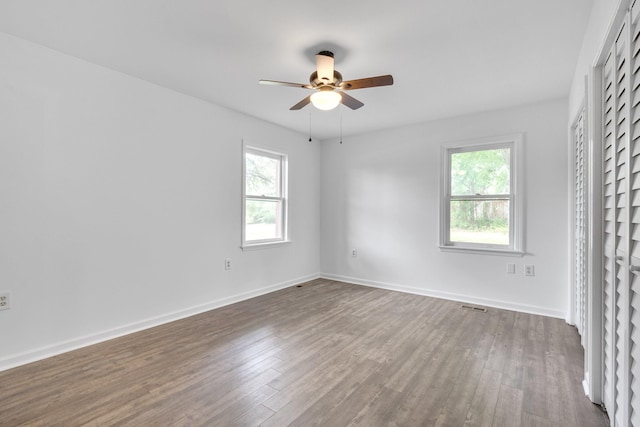 unfurnished bedroom with ceiling fan and hardwood / wood-style flooring