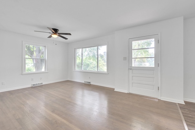 interior space with ceiling fan and hardwood / wood-style floors