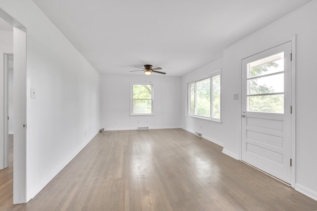 interior space with light wood-type flooring and ceiling fan