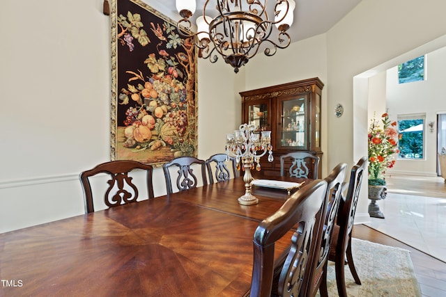 dining room featuring an inviting chandelier and hardwood / wood-style flooring