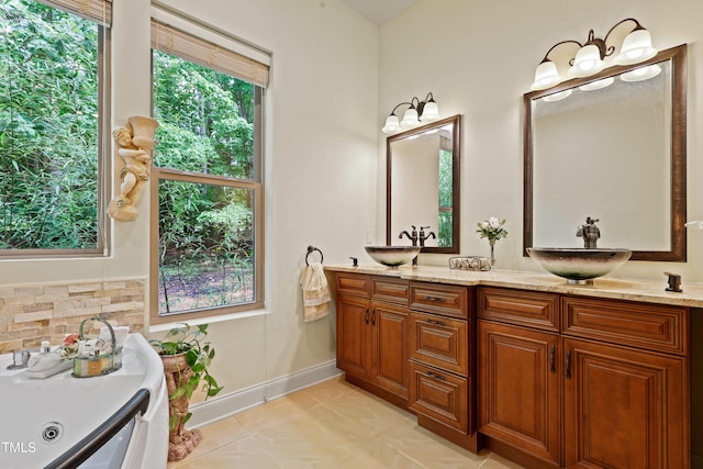 bathroom featuring vanity and tasteful backsplash