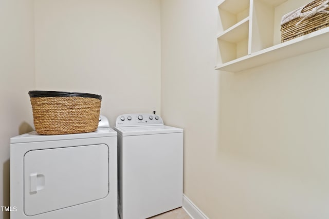 laundry room with separate washer and dryer