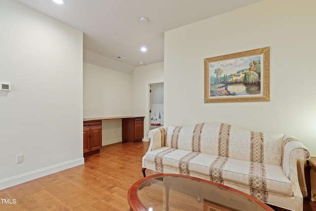 living room with light hardwood / wood-style flooring