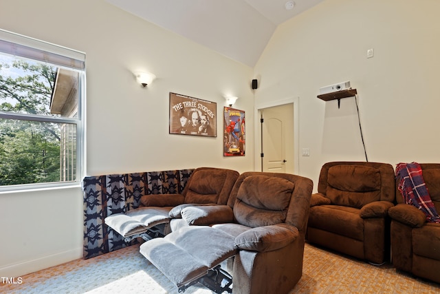 carpeted living room featuring lofted ceiling