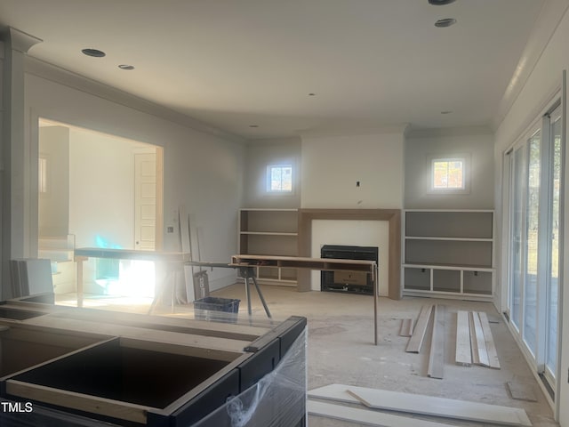 living room with ornamental molding and a fireplace