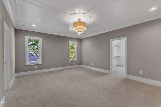 empty room with light carpet, recessed lighting, baseboards, and ornamental molding