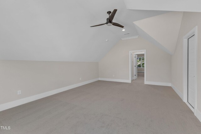 bonus room featuring baseboards, ceiling fan, recessed lighting, light colored carpet, and lofted ceiling