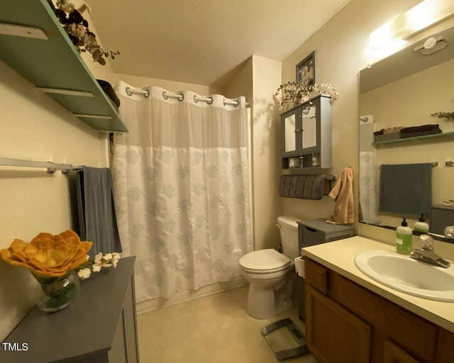 bathroom with vanity, tile patterned floors, shower / bath combination with curtain, and toilet