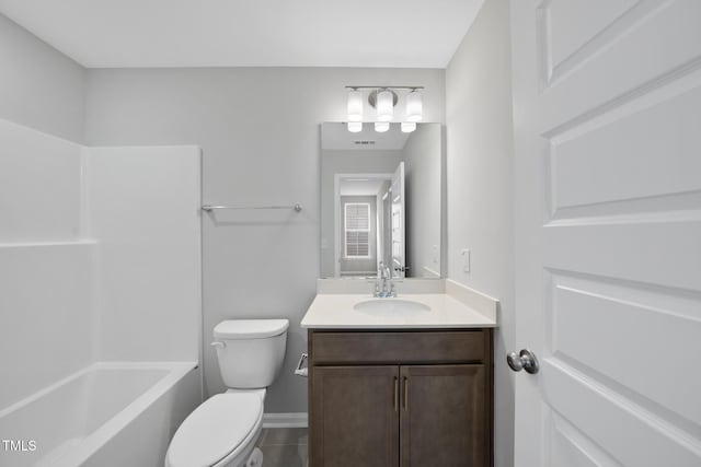 full bathroom featuring tile patterned flooring, vanity, bathing tub / shower combination, and toilet