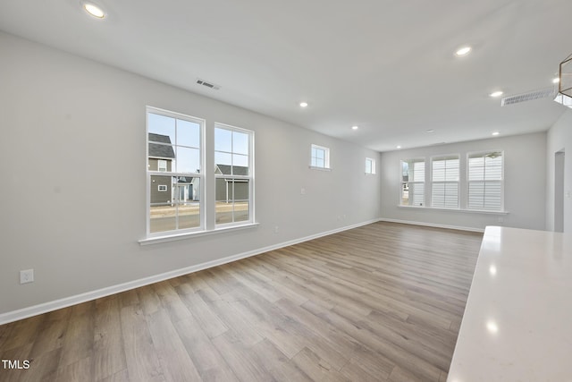 spare room with light wood-type flooring