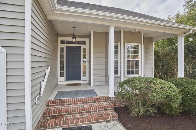 property entrance with covered porch