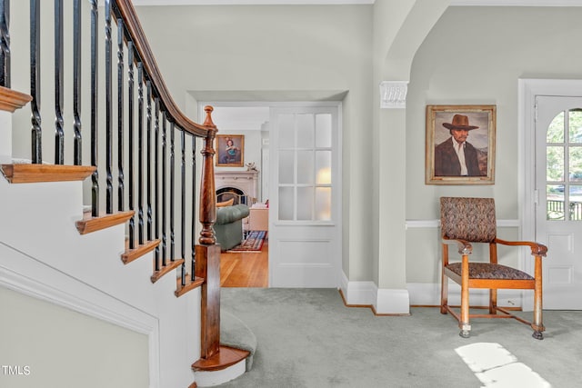 foyer entrance with light colored carpet