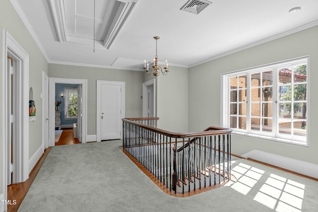 hallway with ornamental molding, light hardwood / wood-style flooring, and plenty of natural light