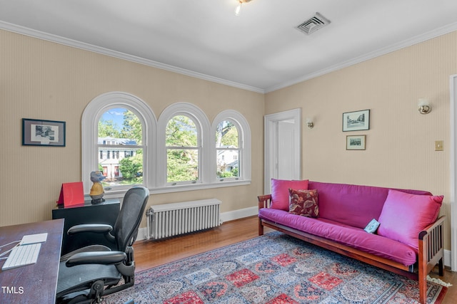 office featuring crown molding, hardwood / wood-style flooring, and radiator