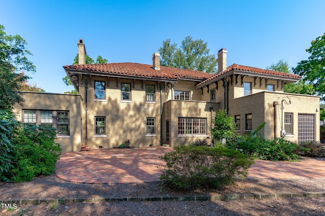 back of property featuring a patio area