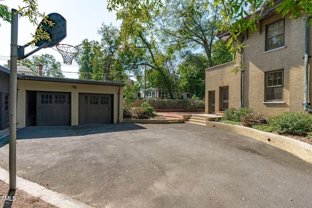 view of property exterior with a garage