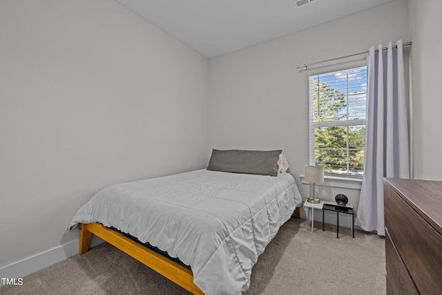 bedroom with light carpet