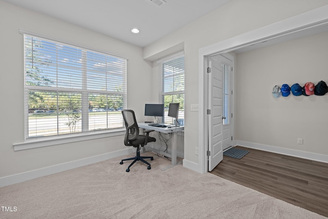 home office with hardwood / wood-style flooring