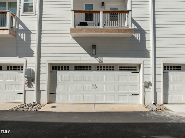 garage featuring wood walls