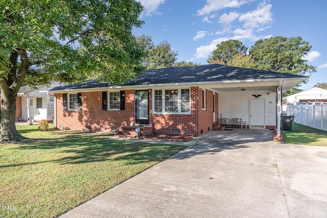 single story home featuring crawl space, a front lawn, driveway, a carport, and fence