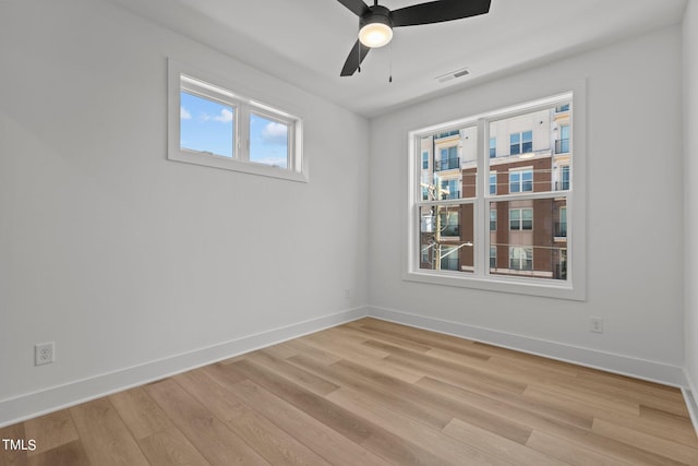 unfurnished room with ceiling fan and light hardwood / wood-style floors