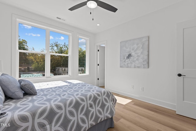 bedroom featuring light wood-type flooring and ceiling fan