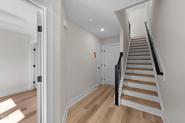 stairway featuring hardwood / wood-style floors