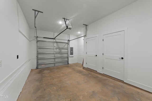 garage featuring electric panel and a garage door opener