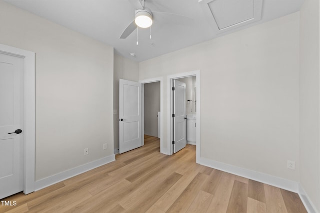 unfurnished bedroom with light wood-type flooring and ensuite bath