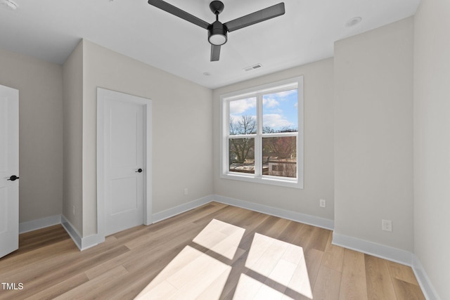 unfurnished bedroom with ceiling fan and light hardwood / wood-style flooring