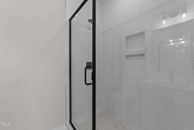 bathroom featuring an enclosed shower