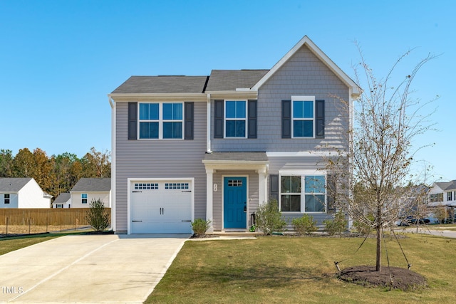 view of front of house with a front lawn and a garage