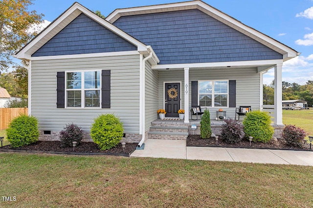 view of front of house with a front lawn and covered porch