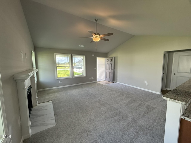 95 Grace Ridge Ct, Benson, NC 27504 - unfurnished living room featuring a fireplace with flush hearth, lofted ceiling, baseboards, a ceiling fan, and carpet