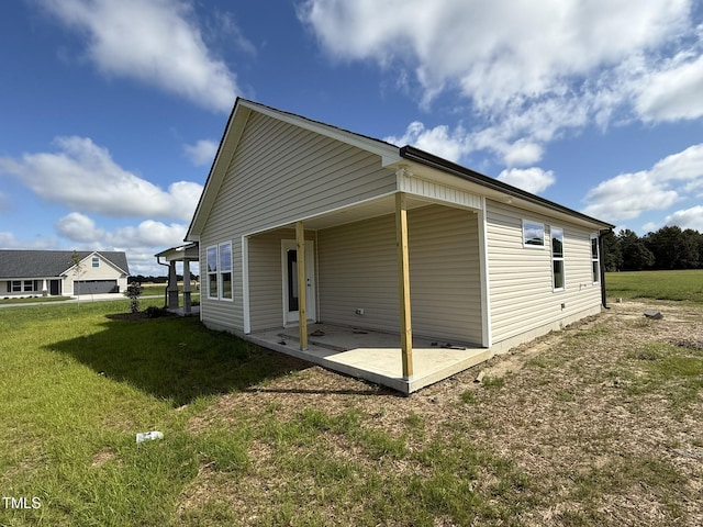 95 Grace Ridge Ct, Benson, NC 27504 - back of property with a patio and a yard