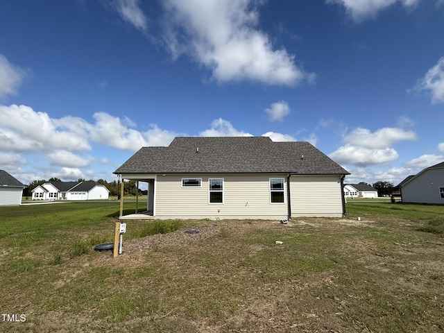 95 Grace Ridge Ct, Benson, NC 27504 - back of property with a yard and a shingled roof